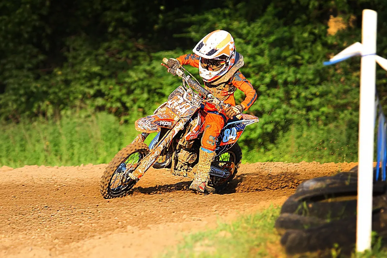 Motocross rider cornering on a dirt track